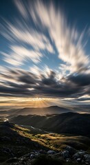 Fototapeta premium Dramatic Sky Over Snowdonia Mountains at Sunset with Motion Blur.
