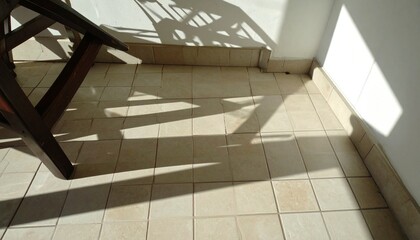 Fototapeta premium Overturned Chair on Sunlit Tile Floor in Closed Dining Area