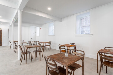 Minimalist Rustic Dining Room with Vintage Metal Tables and Chairs