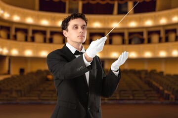 Male conductor in opera house