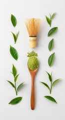 Creative flat lay of matcha tea ingredients including powder whisk and leaves on white background.