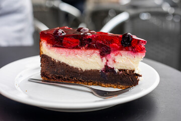 slice of fresh chocolate cheesecake with berries