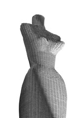 Female mannequin isolated on white background is attractive with black and white shadow effect on wicker form.