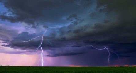 A dramatic lightning bolt illuminates dark storm clouds as turbulent weather intensifies rapidly overhead