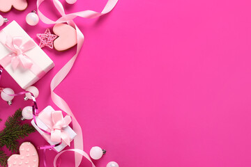 Gift boxes with Christmas decor on pink background