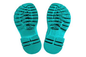 Two teal boot soles with deep tread patterns on black background footwear, Isolated On Transparent Background, Png Cut Out