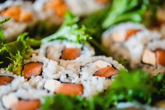 Close up a Philadelphia sushi roll at a Japanese food restaurant  - Powered by Adobe