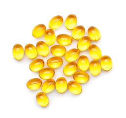 Vitamin E capsules on white background