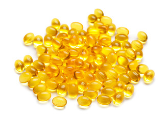 Many vitamin E capsules on white background
