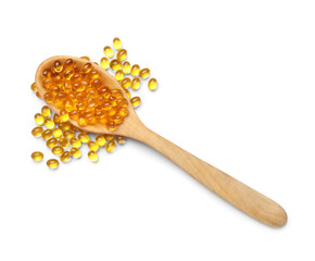 Wooden spoon with vitamin E capsules on white background