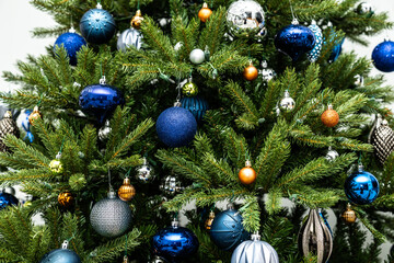Artificial Christmas tree with silver and blue ornaments