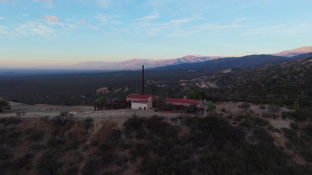 Aerial view of historic Estaci&oacute;n 2 Cable Carril set against mountains in Chilecito, La Rioja, Argentina.