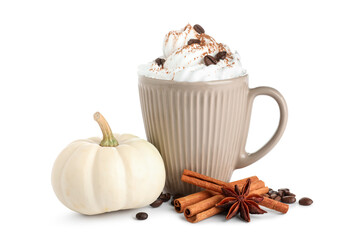 Cup of tasty pumpkin coffee with whipped cream, cinnamon sticks, star anise and beans on white background