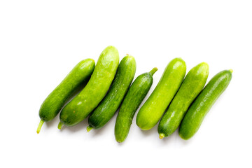 Fresh mini baby cucumbers on white background