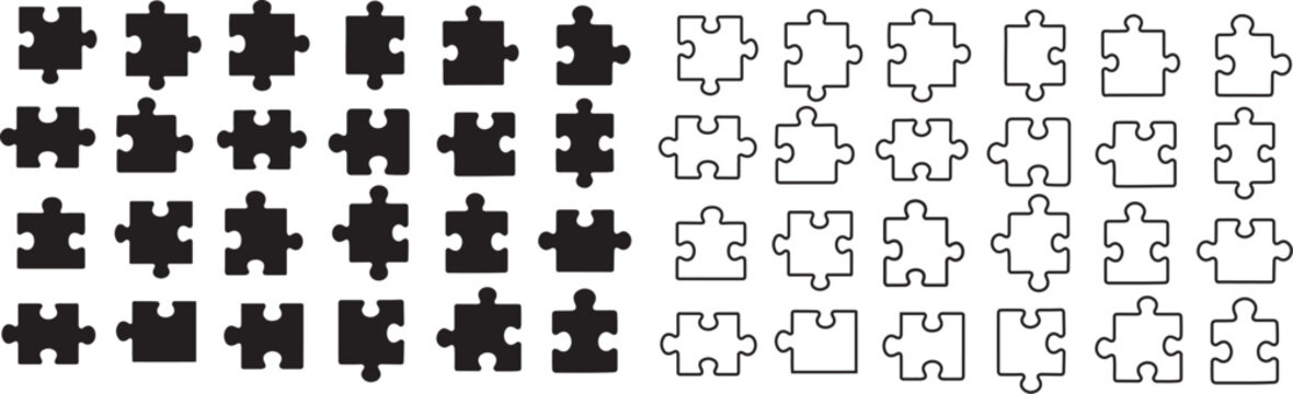 Black silhouette puzzle pieces arranged in various sizes and shapes.	