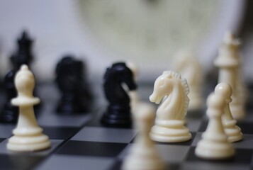 chess pieces on the chess board artistic background game playing competition	
