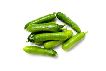 Fresh mini baby cucumbers on white background