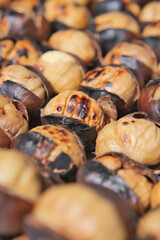 Freshly roasted chestnuts on display at a market