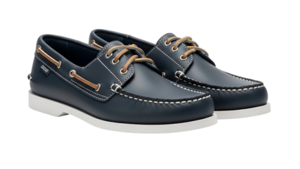 Pair of classic dark blue leather boat shoes with white soles displayed against a black background