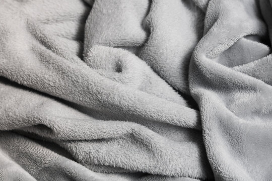 Ultra-soft, plush grey faux fur fabric, ideal for cozy textures, comfortable blankets, wallpaper, lifestyle design, and luxurious backgrounds.