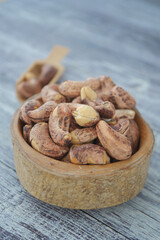 closeup of cashew nuts in a bowl on table 