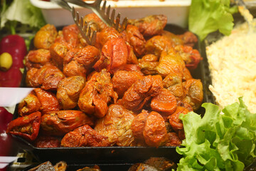 Delicious roasted vegetables at a vibrant market stall