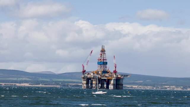 Offshore Oil Rig and Yacht in North Sea Waters