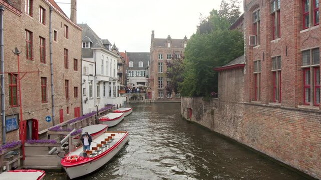 Tour Boat Arriving at Historic Bruges Canal Dock