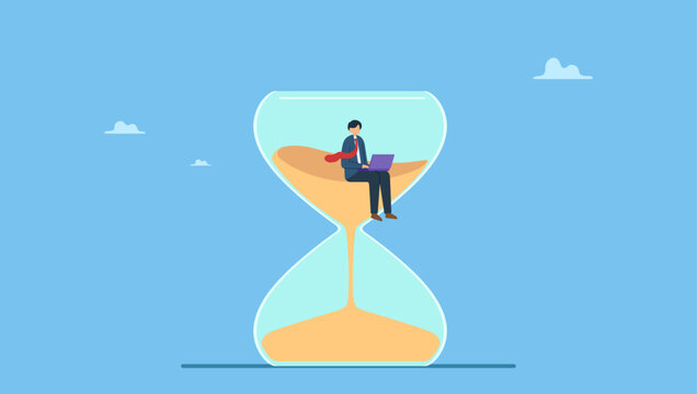 Busy businessman working with laptop inside hourglass count down timer. Work against deadline, time counting down to finish project, efficiency to spend time to complete work within timeline.