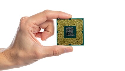 Hand Holding a CPU - Technology and Innovation in Computing.