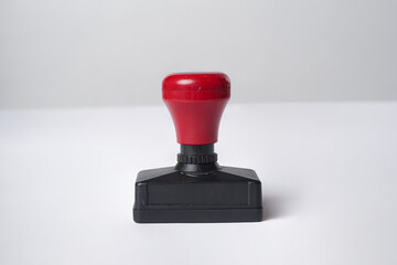 A stamp rests neatly on a solid white background