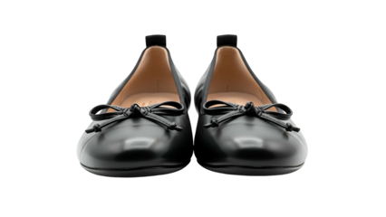 Pair of classic black leather ballet flats displayed against a dark background