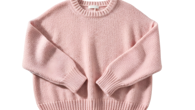 Knitted garment features a soft pink hue and ribbed cuffs against a dark background