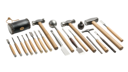 Collection of finely crafted metalworking and carving implements displayed against a black background