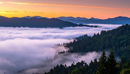 Obraz premium A scenic mountain landscape at dawn, with thick, low-lying fog filling the valleys, trees, and layers of hills