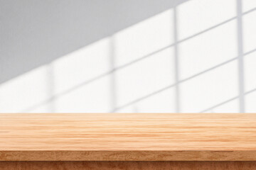 Empty Wooden Table with Soft Window Light on White Wall