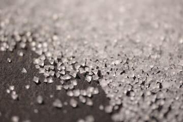 Close-up of the surface of white salt grains, macro salt