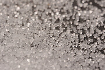 Close-up of the surface of white salt grains, macro salt