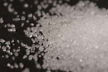 Close-up of the surface of white salt grains, macro salt