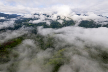 Landscape of Morning Mist with Mountain Layer. mountain ridge and clouds in rural jungle bush forest