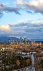 Urban Skyline Of Burnaby Across Autumn Forests Under Cloudy Sky In Greater Vancouver Canada