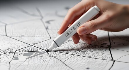 Hand marking a location on a city map with a marker