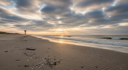 Serene Coastal Vista: A tranquil seascape where the soft sand beach meets the gentle embrace of the ocean. The sky, a canvas of clouds, is painted with the warm hues of sunrise.