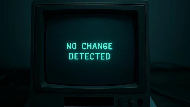 Old computer screen shows glowing green text No Change Detected, evoking nostalgic and retro atmosphere of technology