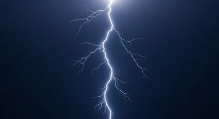 Dramatic lightning strike against a dark blue sky during a thunderstorm