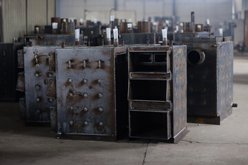 Machines and unfinished spaces create a unique atmosphere in a boiler production facility