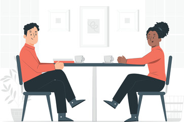 Two people sitting at a table with coffee cups and books woman