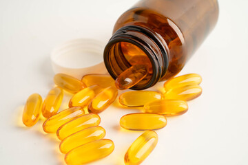 Fish oil or Cod liver oil gel in capsules with omega 3 vitamins, supplementary healthy food.