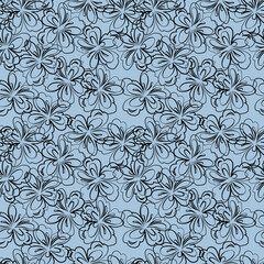 seamless botanical pattern of hand-drawn flowers and leaves on a blue background
