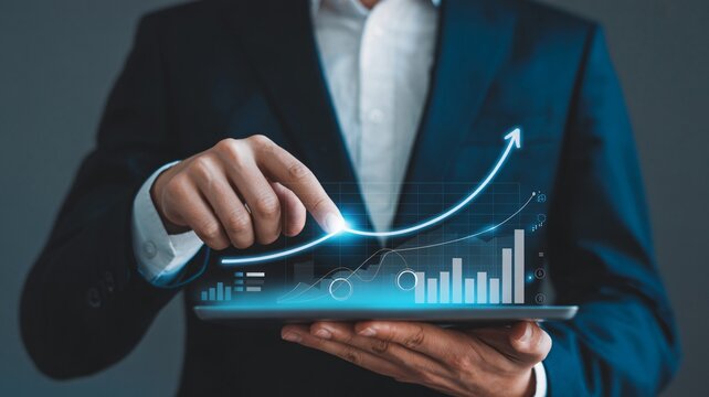 Professional businessman analyzing growing financial graph on tablet, showcasing impressive upward trend and business success with modern technology.